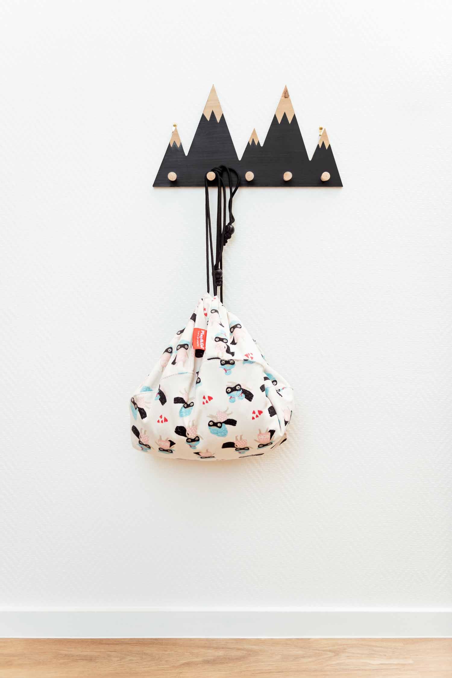 supergirl mini toy storage bag, bag hanging on coat rack