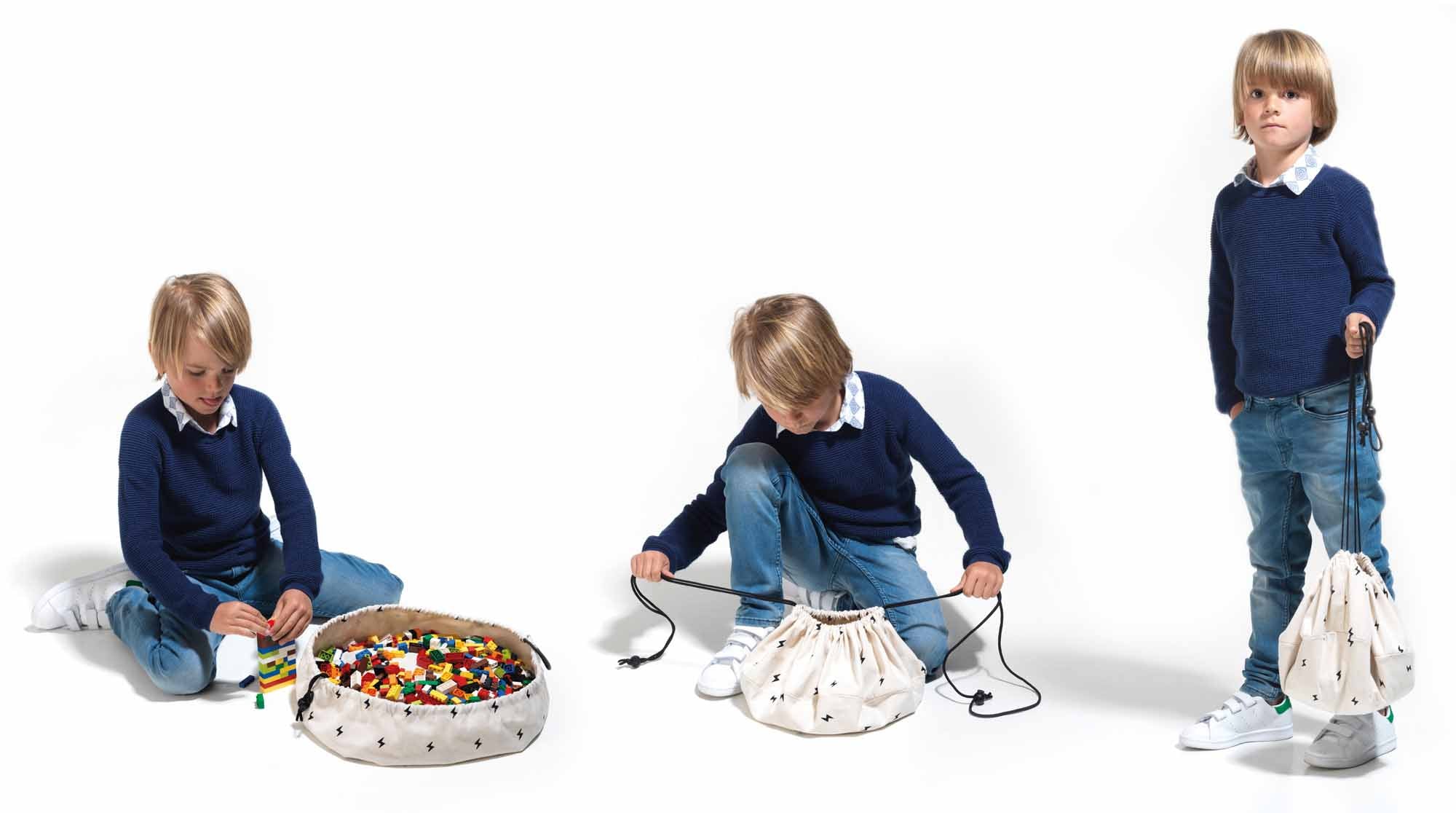 thunderstrike mini toy storage bag, boy playing, boy closing the bag and boy carrying the bag