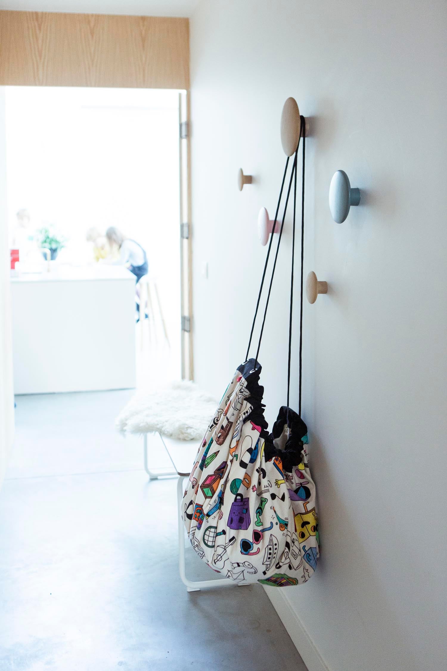 Play&Go storage bag and play mat, Omy Paris, self colored, hanging up on coat rack